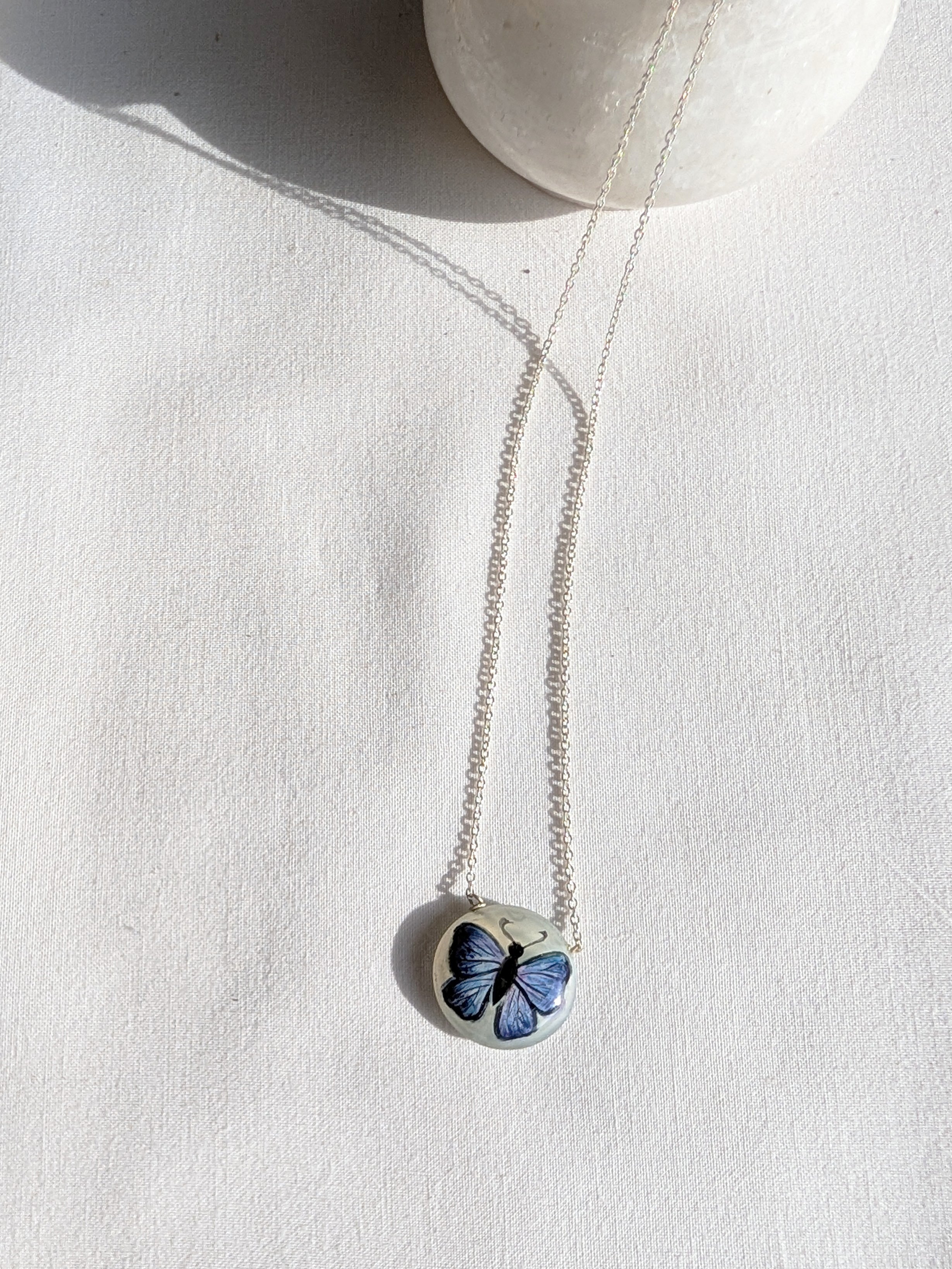 titálee - Butterfly hand painted on Moonstone