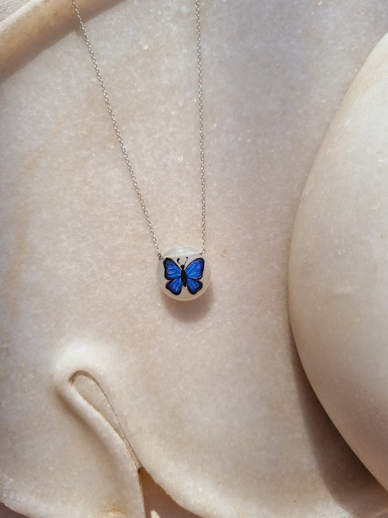 titálee - Butterfly hand painted on Moonstone